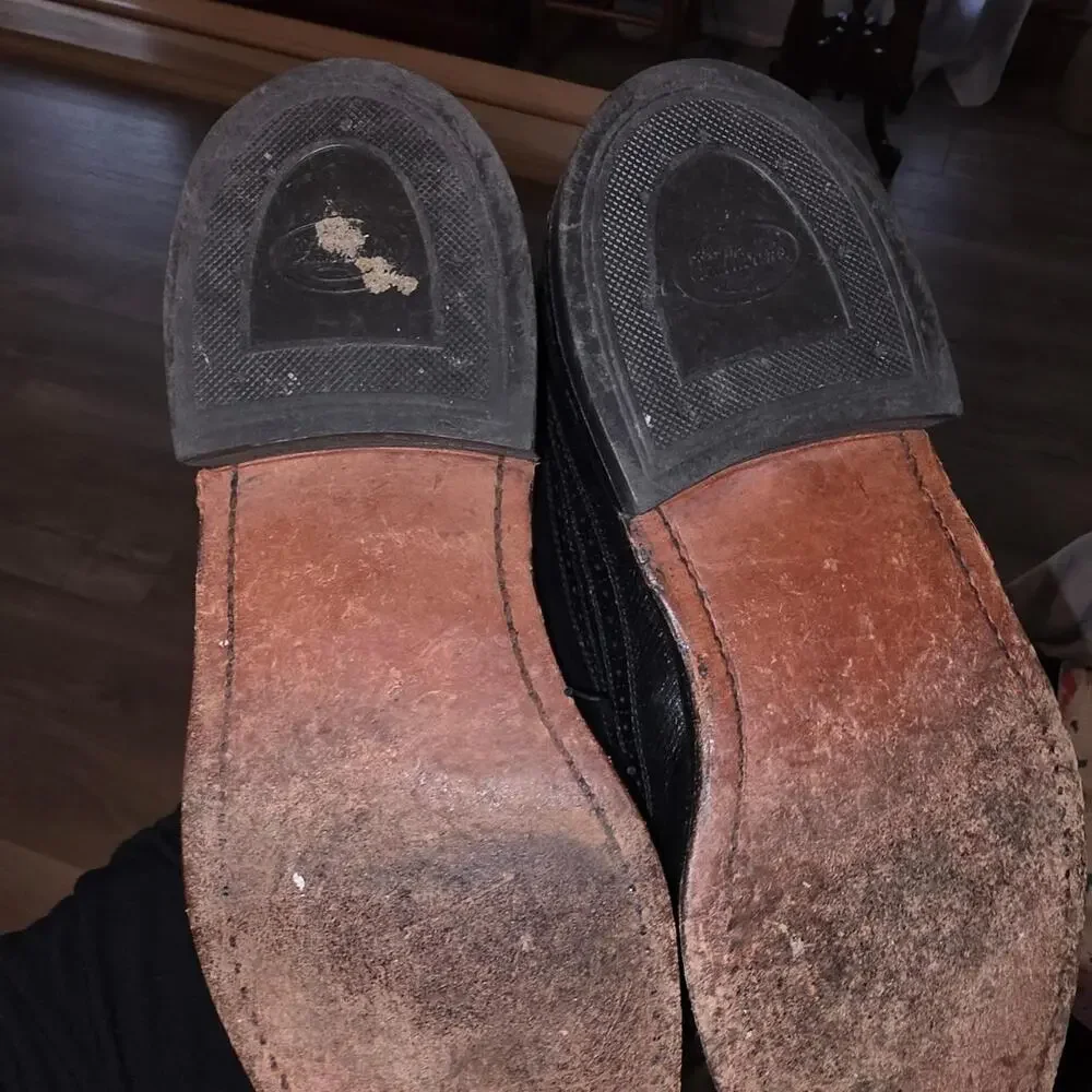 Black leather wingtip dress shoes